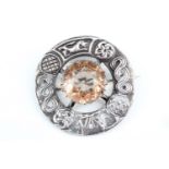 A Scottish Celtic influenced silver plaid brooch, comprising an annulus relief-decorated with Celtic