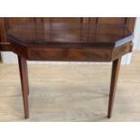 A George III string-inlaid mahogany turn-over-top games table