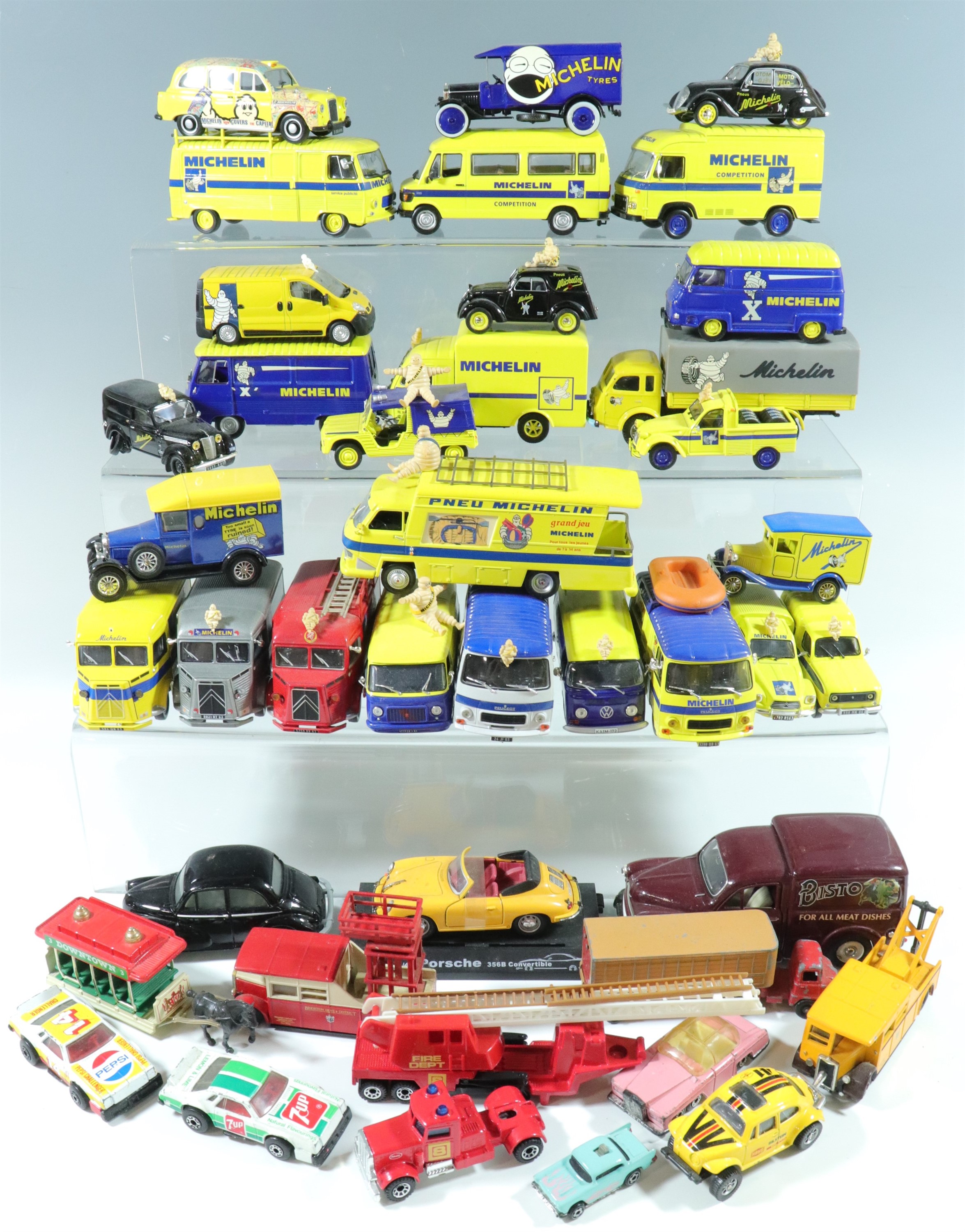 A quantity of Dinky and Matchbox die-cast model Michelin vans etc ( 2 trays)