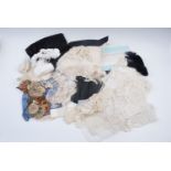 A group of sewing materials including antique lace and crochet work