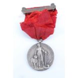 A National Canine Defence League silver medal presented to Arthur Pollitt for bravery, 1919, the