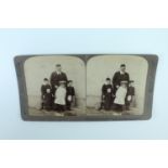 A stereoscope card "From the cares of Empire to the joys of home - Edward VII and his grandchildren,