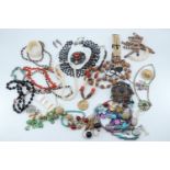 A quantity of vintage costume jewellery including a string coral necklace etc