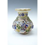 An early 20th Century Japanese moriage earthenware vase, of compressed baluster form with everted