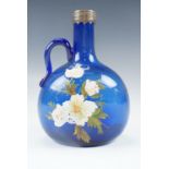 A Victorian mell decanter flagon bearing blue enameled decoration