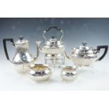 A late Victorian Mappin and Webb five piece silver tea service including a spirit kettle, of