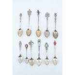 11 white metal souvenir teaspoons, including two French teaspoons having raised bowl design etc, 139