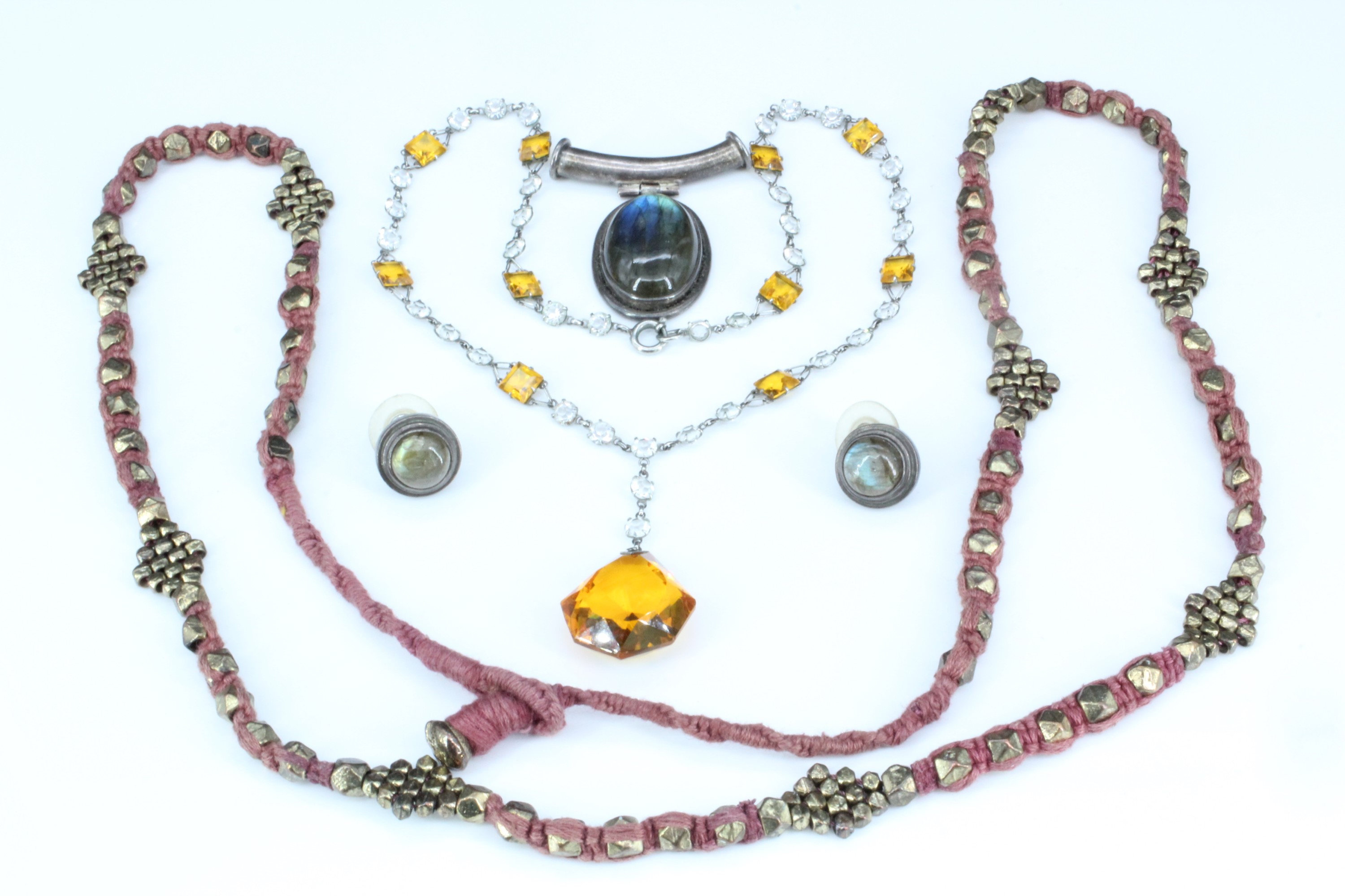 An ethnic gilt metallic bead necklace together with a vintage amber and colourless glass bead