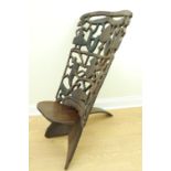 An African carved hardwood folding chair, 113 cm high