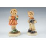 A boxed Hummel figurines "My Toy Train" and "Puppet Princess"