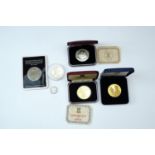 Two Pobjoy silver coins, one commemorating Concorde, together with a 1991 golden eagle medal, a