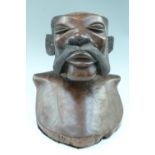 An African carved hardwood bust, 30 x 26 cm