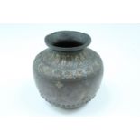 An Ottoman or Middle Eastern chiselled bronze vase, of compressed shouldered form with everted