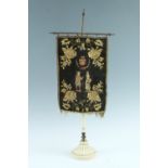 A Victorian embroidered table screen on cruciform gilt metal and earthenware stand, 55 cm