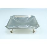 An Art Deco silver dish raised on four pad feet, Harrison Brothers & Howson, Sheffield, 1936, 382 g,
