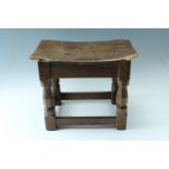 A Robert "Mouseman "Thompson of Kilburn a oak joynt stool, having carved octagonal baluster legs and