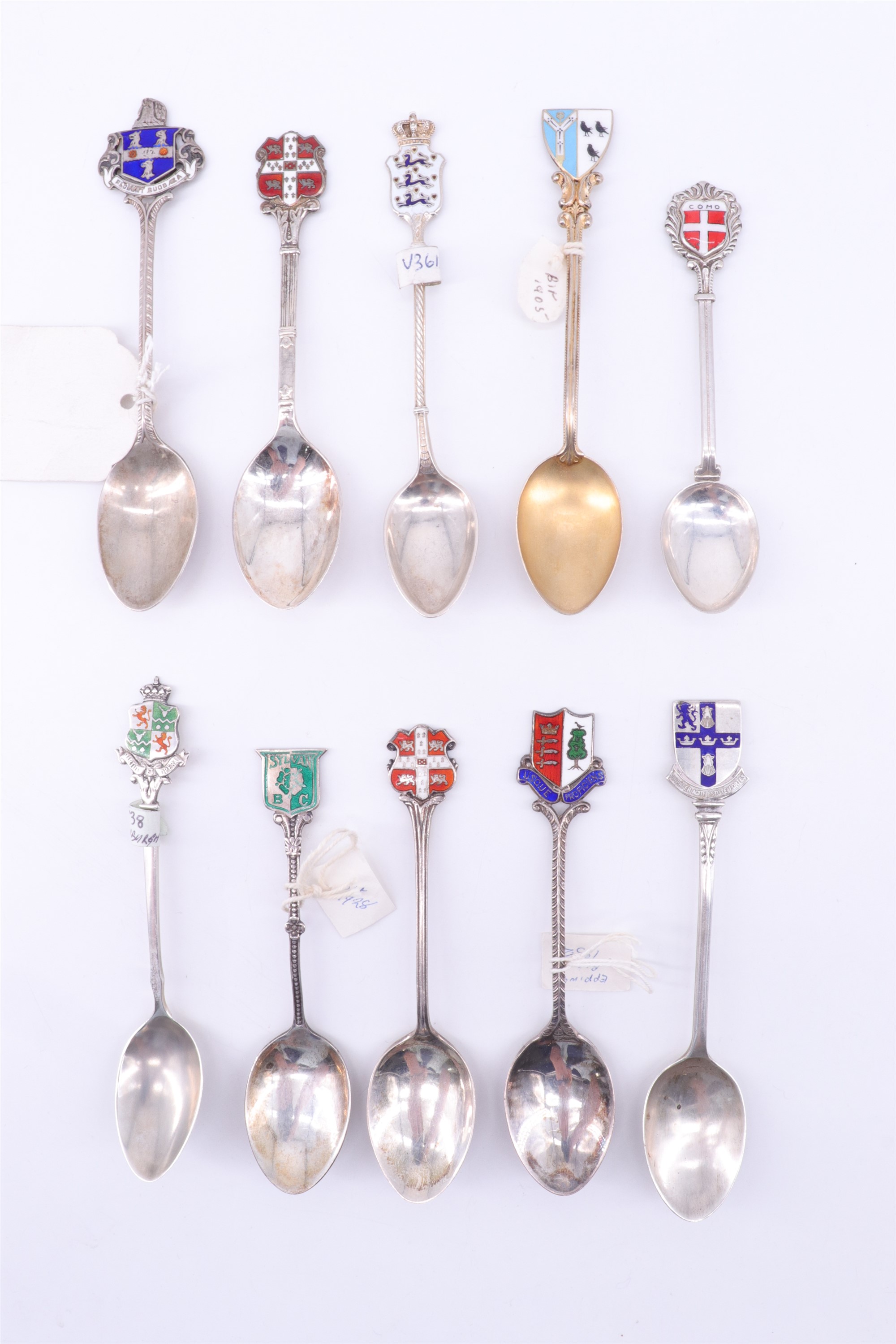 Eight enamelled silver souvenir teaspoons, relating to rugby, cross country running etc, together