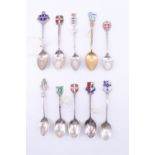 Eight enamelled silver souvenir teaspoons, relating to rugby, cross country running etc, together