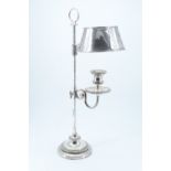 A Victorian columnar candle lamp, having an integral shade and gadrooned base and candle holder,