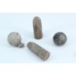 A small group of cast lead musket shot and 19th Century rifle bullets