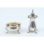 A George III influenced silver salt cellar, of oblate form on three feet, Birmingham, 1903, together