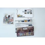 A small quantity of First Day Covers and a smaller quantity of uncirculated British stamps,