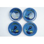 Four Torquay Longpark Pottery hand-painted earthenware dishes decorated in depiction of kingfishers,