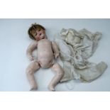 A late 19th / early 20th Century Armande Marseilles bisque headed doll, impressed 990 A6M, having
