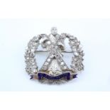 An early 20th Century Queen's Own Cameron Highlanders diamond-set and enamelled precious white and