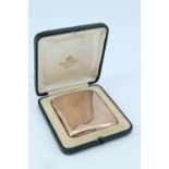 A fine Edwardian 9 ct gold cigarette case, of cushion form contoured to the body, the front