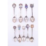 Nine enamelled silver souvenir teaspoons, many baring regional mottos including Liverpool, Canada,