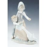 A Lladro figurine children and goose, boxed , 26 cm