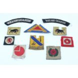 A small group of British and US army cloth insignia including a printed 3rd Infantry Division