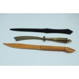 A Great War trench art paper knife, its handle being a French Lebel rifle cartridge, together with