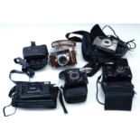 Sundry cased cameras including a Kodak Retina Automatic III, a Canon Sure-Shot 38 mm 1:2.8 camera, a