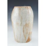 A late 20th Century craft pottery elongated oviform vase, in finely and vertically comb-incised
