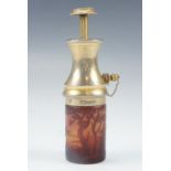 A cameo glass and gilt metal perfume atomizer, the cylindrical glass bottle etched in depiction of