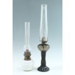 Two oil lamps, tallest 56 cm including funnel