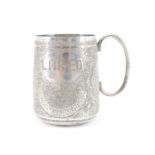 An early 20th Century Asian white metal cup, densely foliate engraved and centred by heart shaped