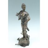 A cast bronze statue Diana, the huntress, with a horn over her shoulder and bearing a quiver of