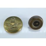 A Second World War escape and evasion button compass, being a small brass RAF button with left-