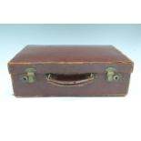 An early 20th Century small brown hide suitcase, 27 cm x 40 cm x 13 cm