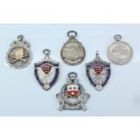 Three 1930s silver target shooting fob medals, a white metal medal, and two electroplate and