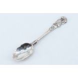 A 19th Century Scottish silver teaspoon, having a cast floral terminal, the back of the bowl bearing