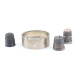 An engine turned silver napkin ring with a vacant cartouche, Birmingham, 1940, together with three