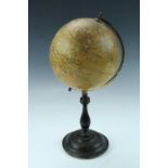 A 1930s table top "Geographia" 6" terrestrial globe, printed paper covered globe on a turned