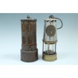 Two miners' safety lamps and a Governor trademark vehicle radiator / sump heater
