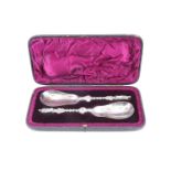 A Victorian cased pair of silver anointing spoons, each having a pear shaped bowl, a stem formed