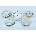 Four various pocket watch movements and a travel timepiece face