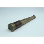 A Victorian small pocket three-draw brass telescope, having a 1 1/4 inch objective lens, 8.5 cm x 24